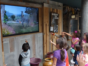 Children interacting with an animated zebra at the San Diego Safari Park